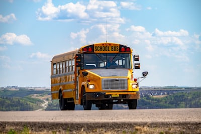 Yellow school bus on a road